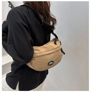 Detail of khaki crescent crossbody bag in crinkled nylon with Lucky Fashion logo