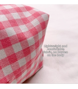 Detailed macro view of the pink gingham canvas fabric and high-quality weave texture