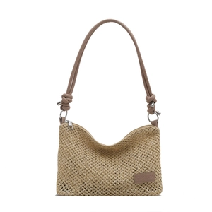 Fashionable woven straw tote bag for women with leather shoulder straps and logo detail