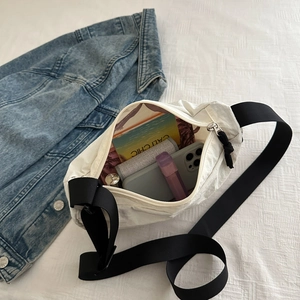 Minimalist white nylon dumpling crossbody bag with adjustable black strap and large capacity