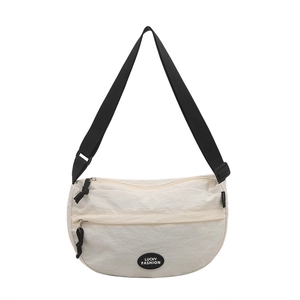 Japanese style cream half-moon crossbody bag with adjustable strap and front zipper pocket