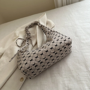 Plaid pattern canvas shoulder bag with bow prints and ruffled cloud strap design