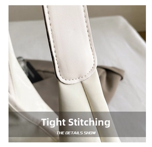 Close-up of fine stitching and premium leather texture on casual bucket bag detail