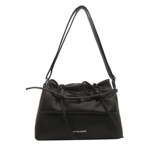 Minimalist black matte leather shoulder bag with decorative bow and fashion text