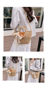 Detail of woven straw bucket bag featuring a large pearl clasp and delicate lace bow accent