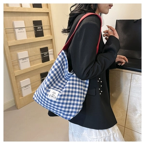 Blue and white checkered canvas bucket bag with contrast red straps and EMIS brand label