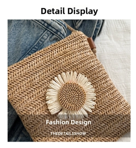 Close-up of straw crossbody bag featuring a large daisy flower and braided rope strap