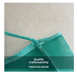 Detailed macro view of vibrant green mesh fabric showing high-quality stitching and texture
