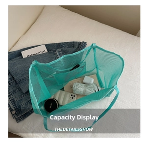 Internal view of mint green mesh tote bag showing large capacity and inner pocket detail