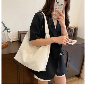 Spacious creamy white PU leather tote bag shown in a stylish mirror selfie for daily use