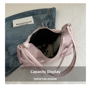 Pink hobo tote bag showing interior space for phone, sunglasses and small umbrella