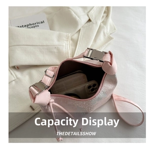 Top view of pink jacquard bag showing interior space with phone and long wallet