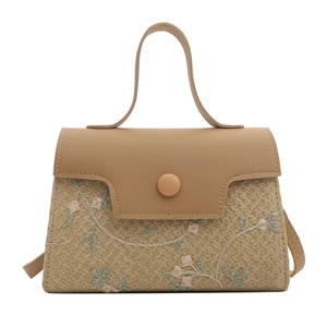 Chic woven straw handbag with floral embroidery and brown leather flap for women