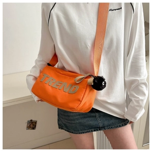 Orange nylon crossbody bag with TREND embroidery and wide shoulder strap