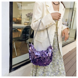 Detail of purple sequin hobo bag with shiny metallic texture and silver chain strap