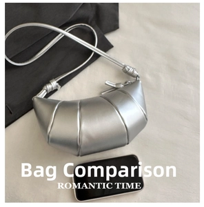Silver croissant bag detail showing quilted pleats and size comparison with a smartphone