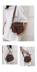 Detail view of brown corduroy crossbody bag with strawberry patterns and woven drawstring strap