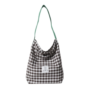 Large checkered canvas tote bag with green straps and minimalist EMIS logo design