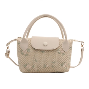 Chic beige woven handbag with floral embroidery and detachable strap in a minimalist style