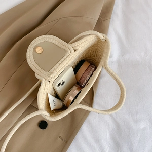 French style woven tote bag with pearl handle showing spacious interior and magnetic closure