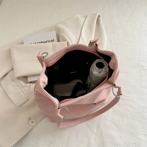 Pink glossy butterfly tote bag with large capacity showing interior storage space