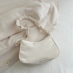 Elegant off-white pleated shoulder bag in satin texture for a minimalist French chic look