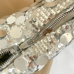 Silver sequin chain shoulder bag with metallic zipper and durable mesh lining