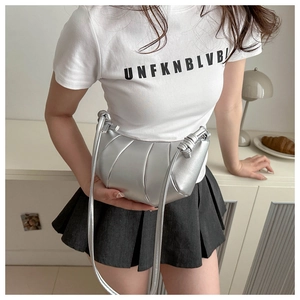 Detail of silver crescent leather bag with pleated texture and stylish knotted shoulder strap