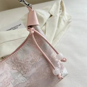 Pink jacquard floral shoulder bag with traditional Chinese architecture pattern and beads