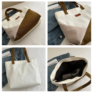 Detail shots of geometric patchwork tote bag with fashion label and zipper closure