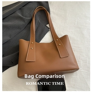 Brown leather tote bag featuring golden rivet details and spacious interior for smartphone