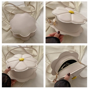 Detailed views of a floral-shaped crossbody bag in cream white with yellow button center