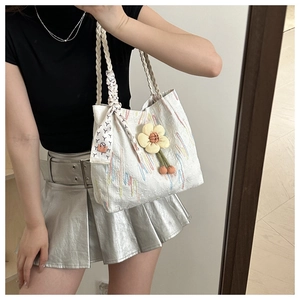 Chic white canvas tote bag with embroidered stripes and woven handle for summer casual style
