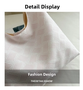 Close-up of geometric 3D embossed texture and premium lining on white tote bag
