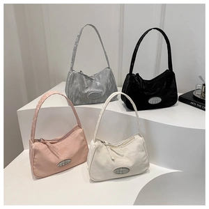 Minimalist nylon underarm bags in four colors with embossed texture and metal logo
