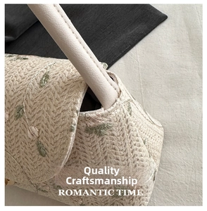 Close-up of floral embroidery on a beige woven shoulder bag with detailed lace texture