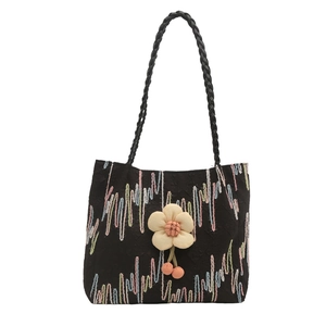 2024 stylish black canvas tote bag with colorful embroidery and a 3D flower charm