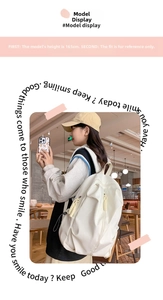 Detailed view of white minimalist nylon travel backpack on a model in a cafe setting