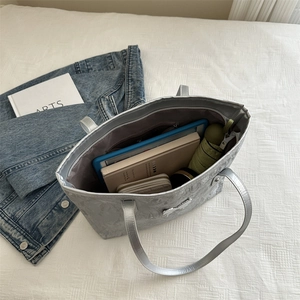 Silver metallic pleated tote bag for women showing spacious interior for tablets and daily items