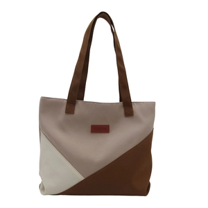 Canvas tote bag with geometric color-block design in beige and brown for daily commute