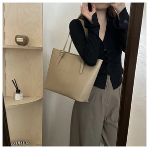 Large earth tone tote bag with geometric stitching and fine matte leather texture