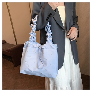 Light blue ruched tote bag with pearl accents and ruffle handles for women