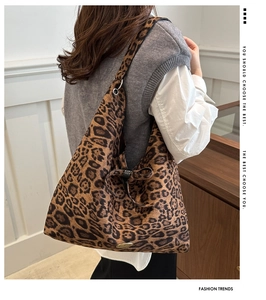 Detail of leopard print tote bag with soft fabric texture and bow tie knot decoration