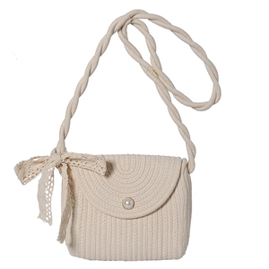 Straw woven crossbody bag in cream white with large pearl accent and lace bow detail