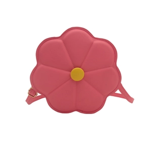 Pink flower-shaped crossbody bag with yellow center and adjustable shoulder strap
