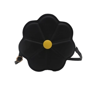 Unique flower-shaped crossbody bag in black matte leather with yellow center floral detail