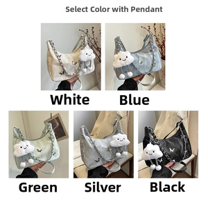 Detail showing various colors of pleated bags with chain straps and butterfly charms