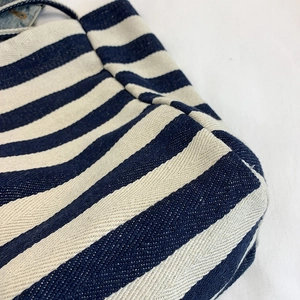 Close-up of blue and white striped canvas tote bag showing twill texture and stitching