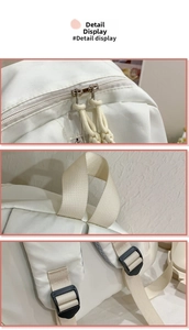 Detail view of double zippers, reinforced top handle and adjustable strap buckles