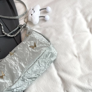 Pale green pleated tote bag with silver butterfly charms and cute cloud plush accessory